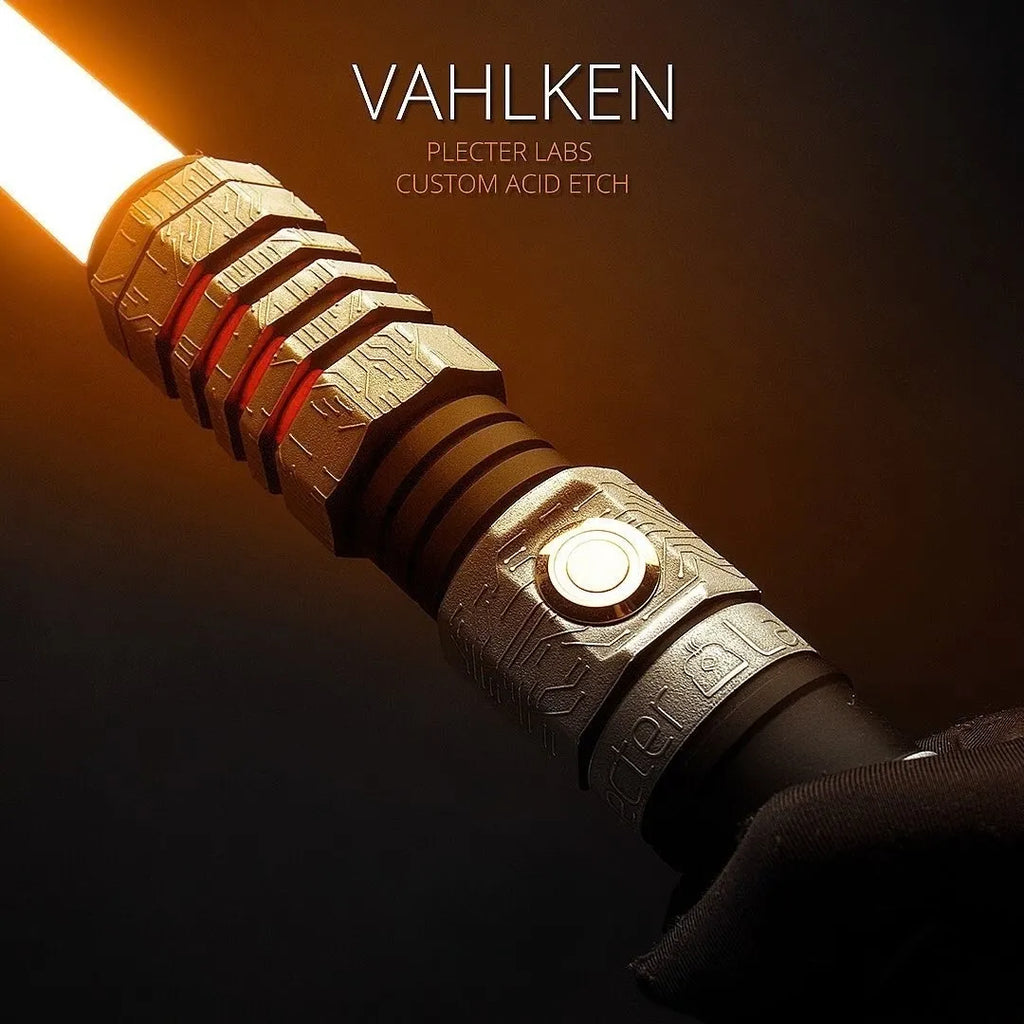 Close-up of a custom Vahlken lightsaber with tangerine-colored circuit board etching details