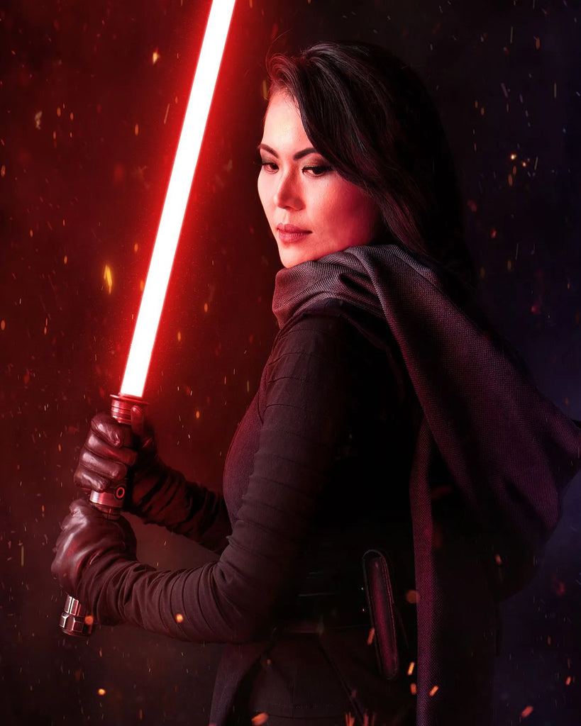 Female Sith cosplayer holding a Star Wars-inspired custom neopixel lightsaber with a red blade