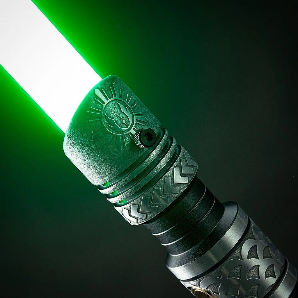 Close-up of Darth Vader-inspired custom neopixel lightsaber features a green blade and acid-etched Jedi Order symbols