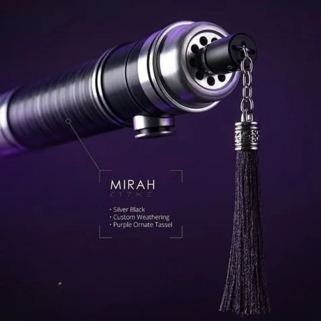 Close-up of the pommel section of a custom neopixel lightsaber features a Silver Black finish and a purple ornate tassel