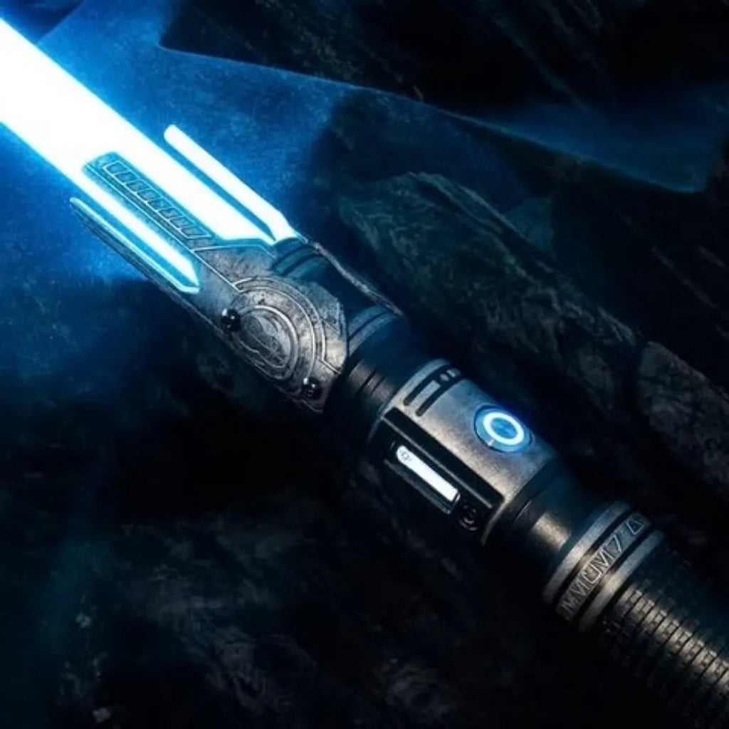 Close-up of a Cal Kestis-inspired custom neopixel lightsaber features Zeffo mural acid etching, weathered finish, illuminated by bright blue blade
