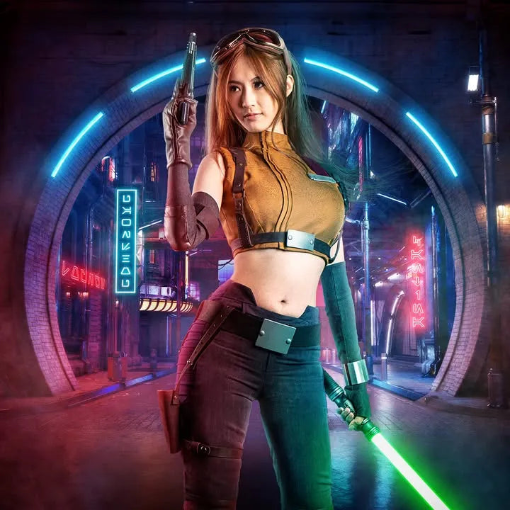 Female Mara Jade-inspired cosplayer holding a Clone Wars-inspired custom neopixel lightsaber with a green blade and a blaster